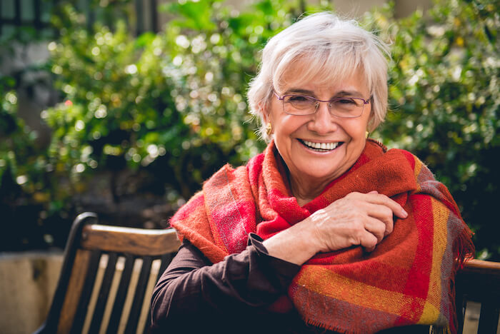 Senior woman with bright scarf wrap