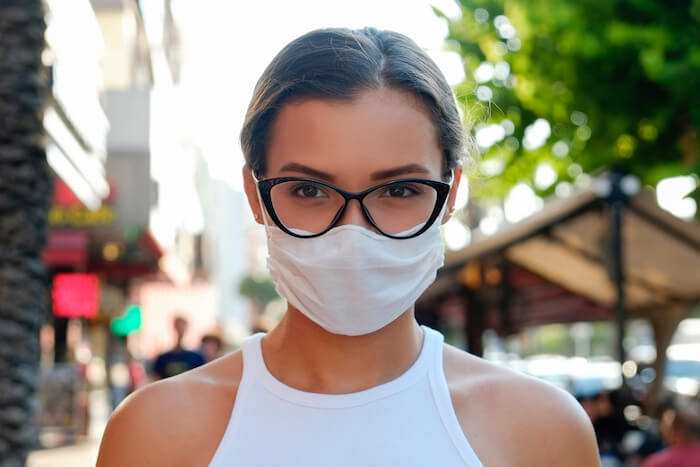 Woman wearing mask and trendy glasses