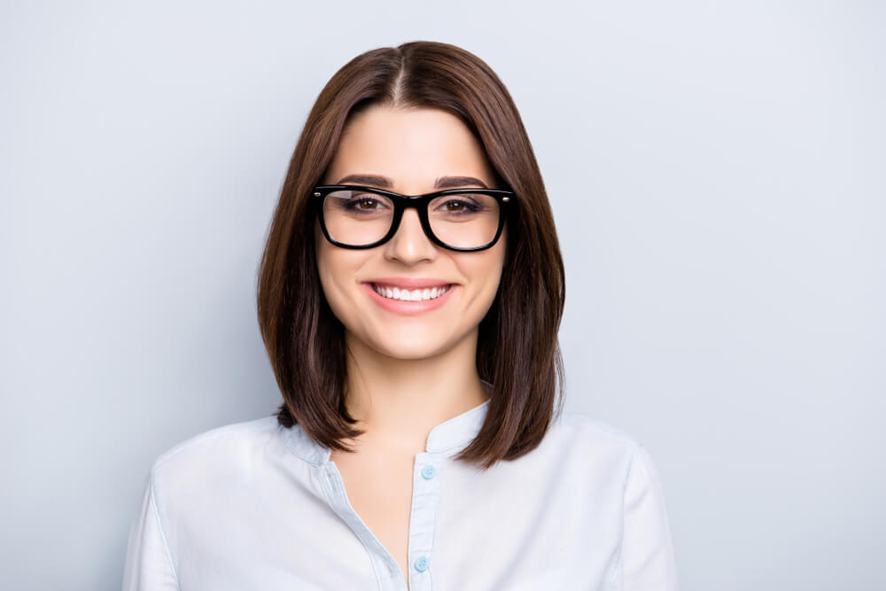 Woman in glasses smiling